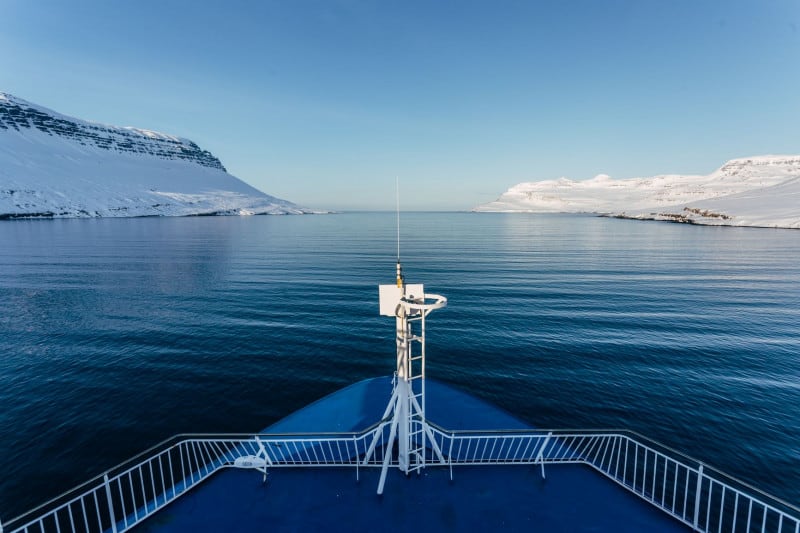 Research ROV vessel sailing through arctic fjord in Iceland