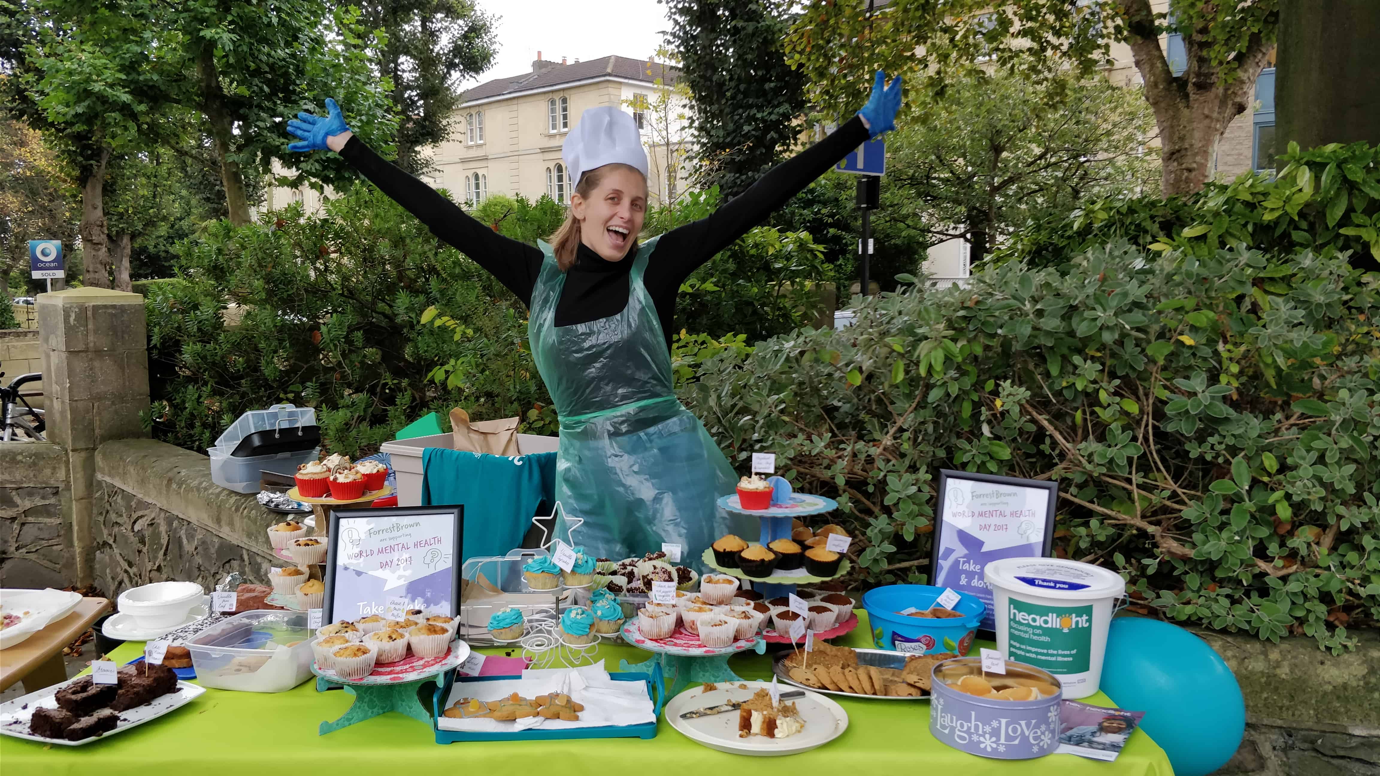 Ele and cakes at charity bake sale for Headlight Mental Health Charity