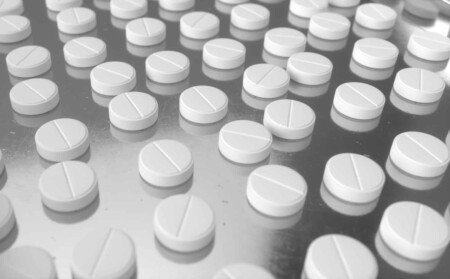 Image showing pills on a pharmaceutical production line.