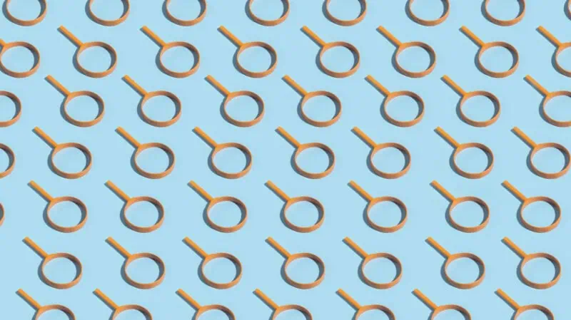 Magnifier on blue background forming pattern